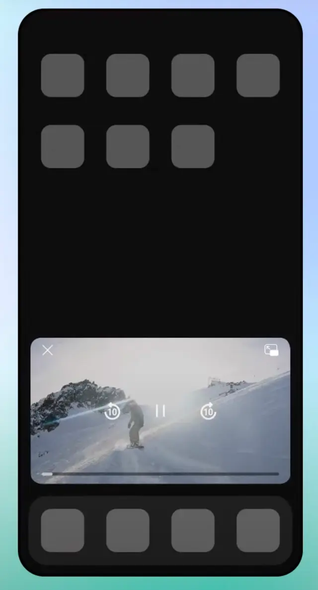 Image represents a mobile phone screen displaying a video player interface. The screen is predominantly black, with a rectangular video player occupying the central portion.  The video shows a snowboarder on a snowy mountain slope.  The video player includes a close button (an 'X' in the top left corner), a full-screen button (a square with an arrow pointing out in the top right corner), a play/pause button (||) centered below the video, and two circular buttons with a '10' inside, positioned on either side of the play/pause button, likely representing a 10-second skip forward or backward functionality. A thin horizontal progress bar is visible below the video. Above and below the video player are rows of six gray, square placeholders, likely representing icons for additional features or controls, though their specific functions are not indicated. The overall arrangement is vertically oriented, with the video player sandwiched between two rows of these placeholder icons.  The phone screen itself is bordered by a slightly lighter, almost teal, background.